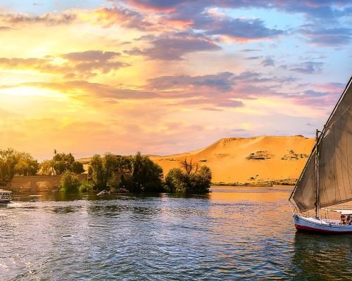 Sailboat on river Nile at sunset in Aswan, Egypt